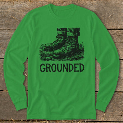 Green long sleeve shirt with black graphic of boots and "GROUNDED" text.