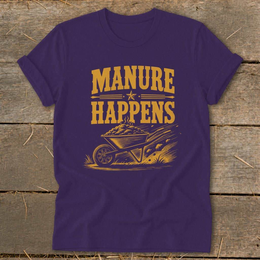 Purple t-shirt with "Manure Happens" text above a wheelbarrow full of steaming manure.