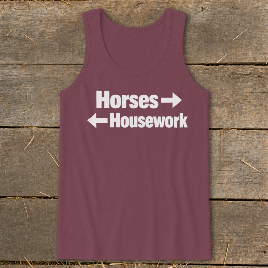 A maroon women's tank top with white text that reads Horses with a right-pointing arrow above Housework with a left-pointing arrow.
