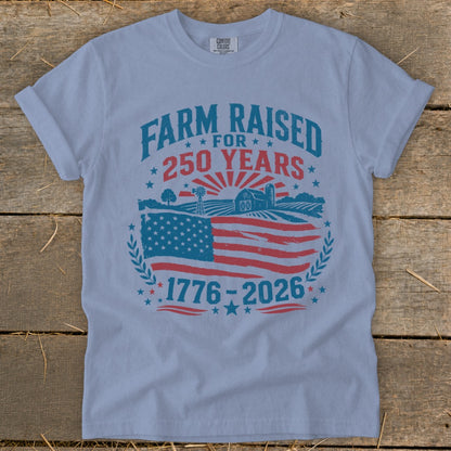 Light blue t-shirt with "Farm Raised For 250 Years" and American flag graphic.