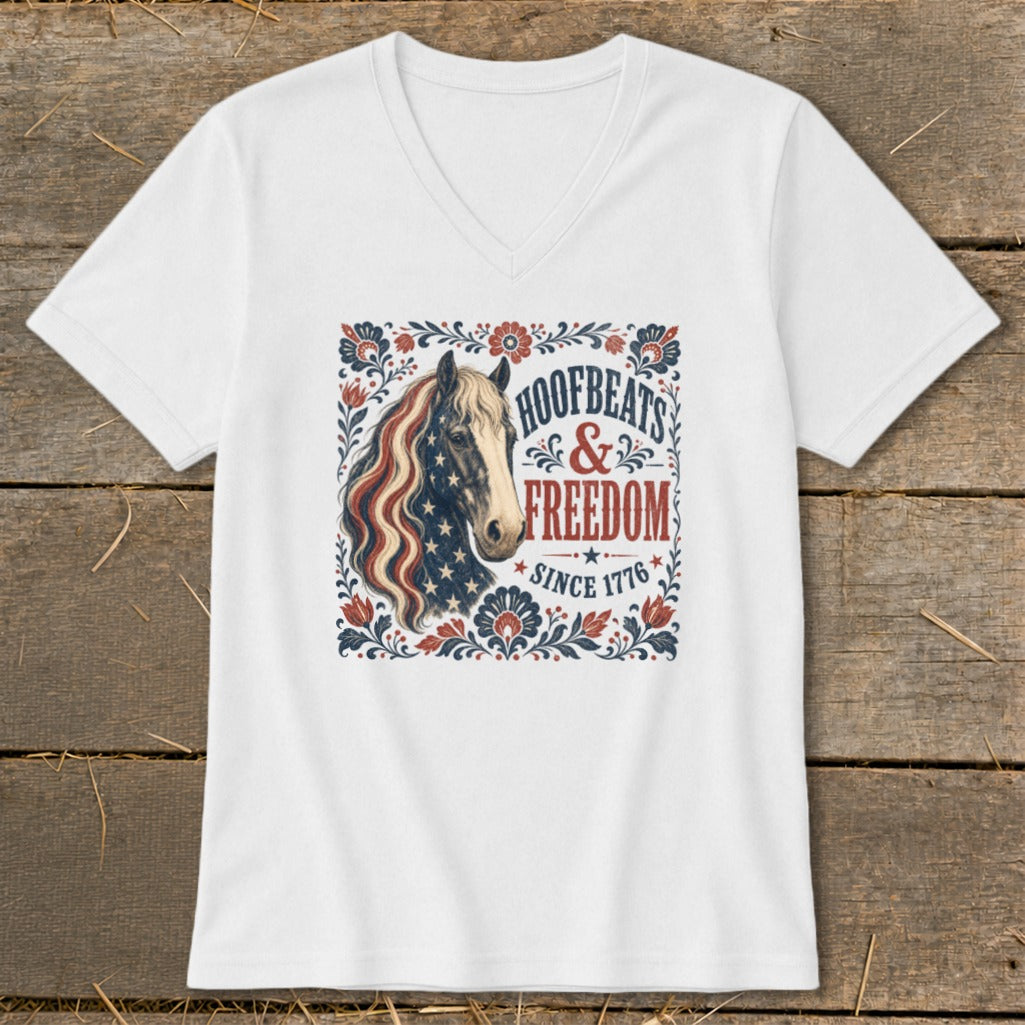 White v-neck t-shirt with patriotic horse graphic and text "Hoofbeats & Freedom Since 1776".