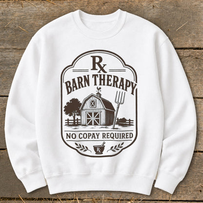 White sweatshirt with "Barn Therapy" graphic featuring a barn, pitchfork, and text "No Copay Required".