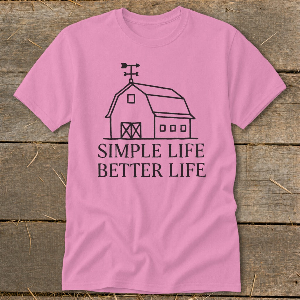 Pink t-shirt with black line art of a barn and text "SIMPLE LIFE BETTER LIFE".