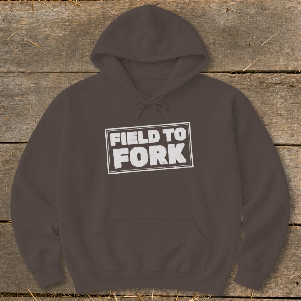 Dark brown hoodie with a front kangaroo pocket and the white text FIELD TO FORK centered on the chest.