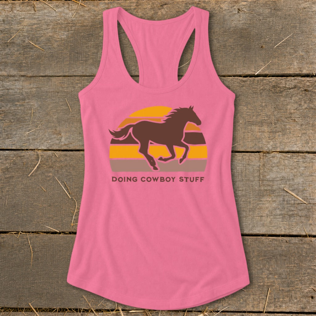 Pink tank top with a running horse graphic and "Doing Cowboy Stuff" text.