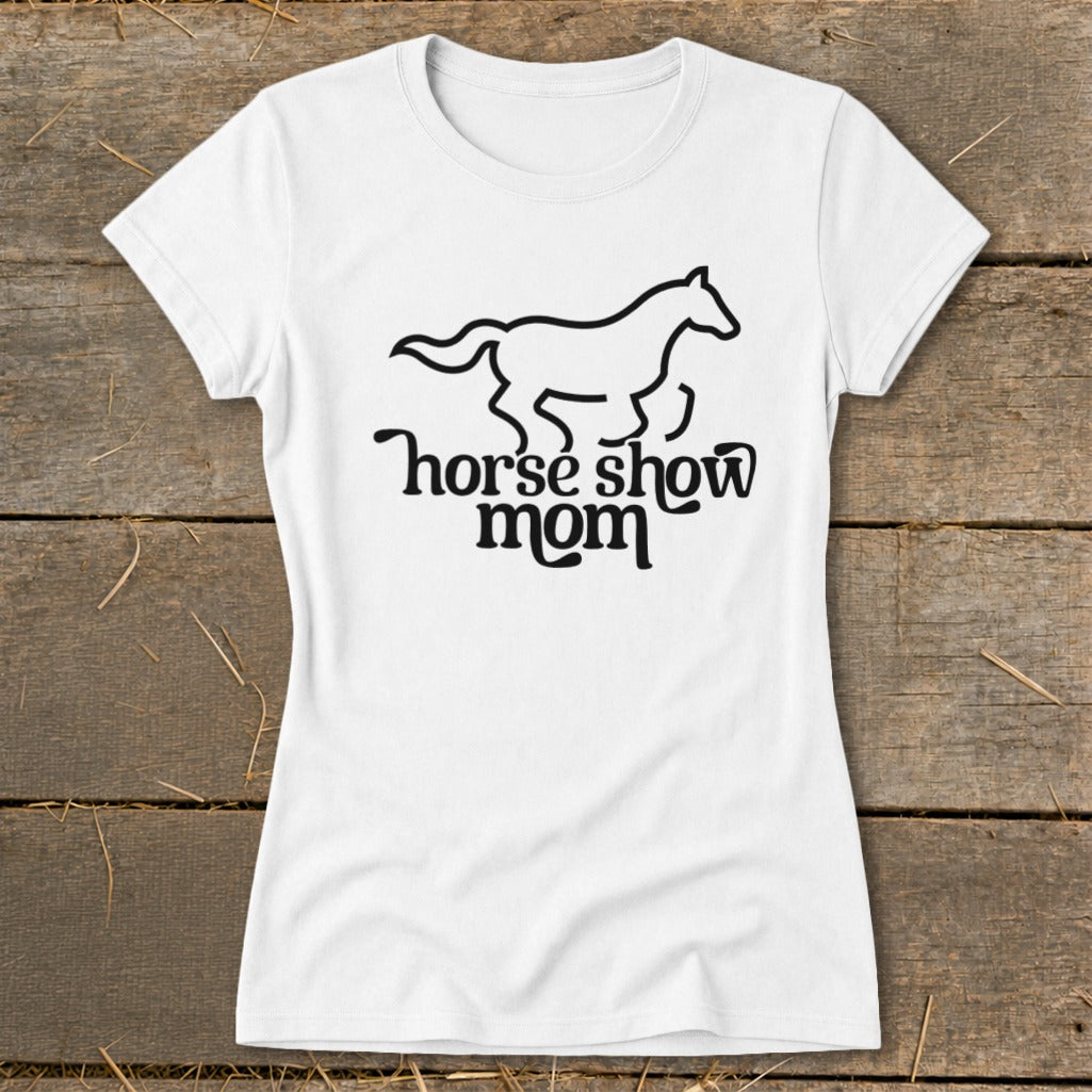 White t-shirt with black line art of a running horse and text "horse show mom."