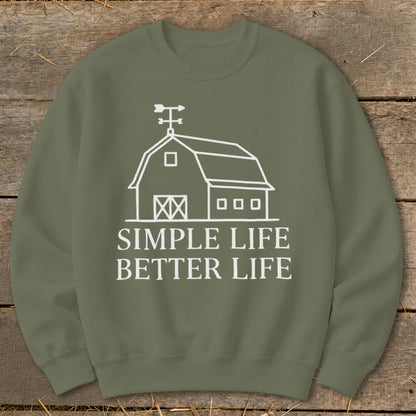 Olive green sweatshirt with white barn graphic and text "SIMPLE LIFE BETTER LIFE".