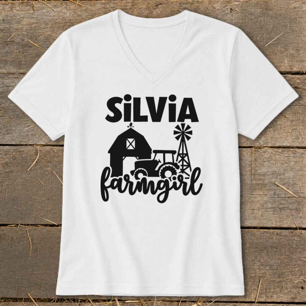 White v-neck shirt with "Silvia farmgirl" text and farm graphics.