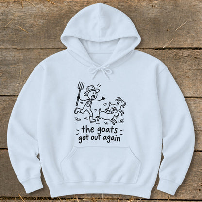 White hoodie with black line drawing of a farmer chasing two goats, with text "the goats got out again".
