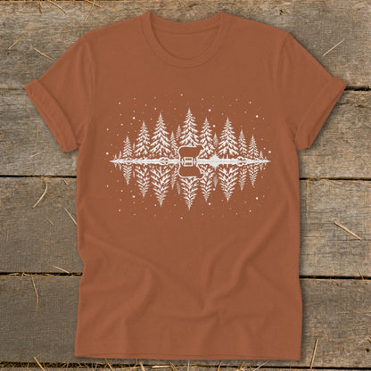 T-shirt with white forest and guitar graphic reflecting in water.