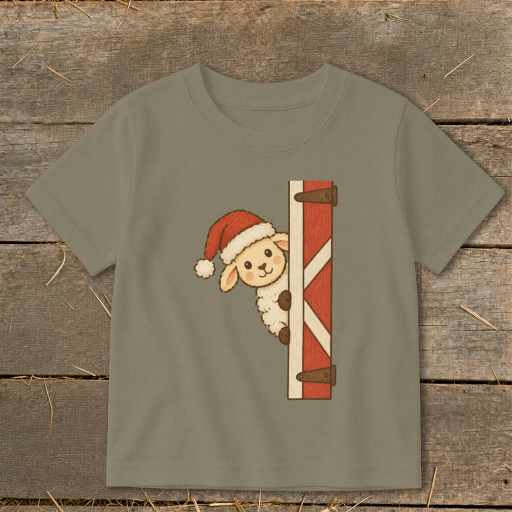 Cartoon sheep in Santa hat peeking from behind a red barn door.