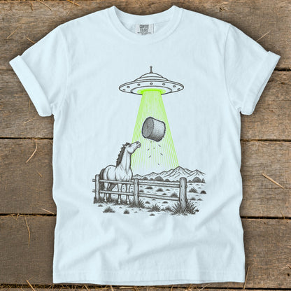 T-shirt graphic of a horse in a fenced pasture being abducted by a UFO.