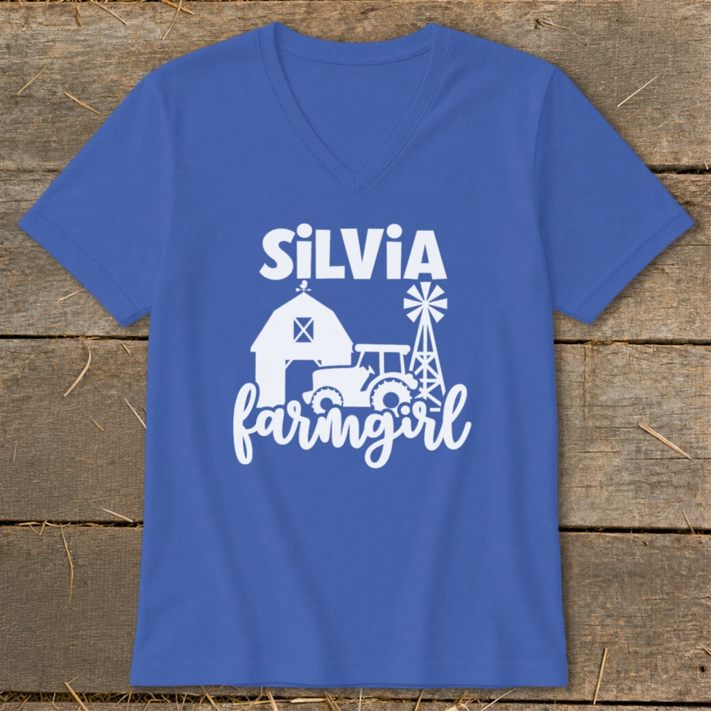 Blue v-neck t-shirt with white text and farm graphics: "SiLViA farmingirl".