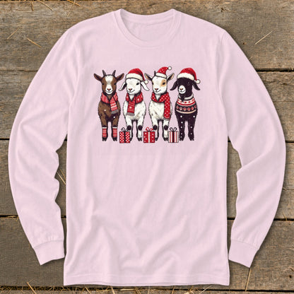 Four cartoon goats wear Santa hats, scarves, and festive sweaters, standing near gifts.