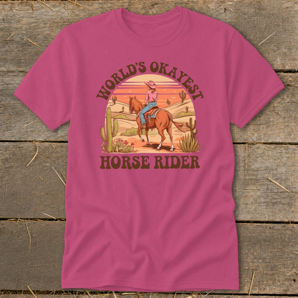 T-shirt graphic with desert scene and text "World's Okayest Horse Rider".