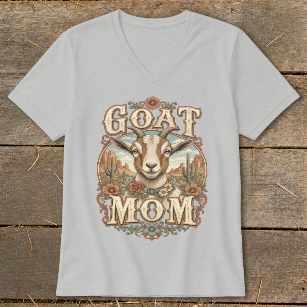Goat Mom graphic on a light gray v-neck t-shirt with desert scene.