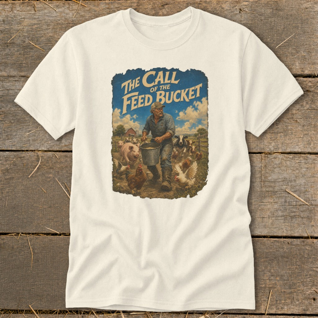 Cream t-shirt with graphic of a farmer feeding farm animals and text "The Call of the Feed Bucket".