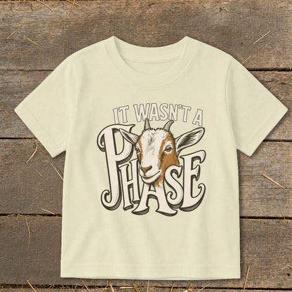 Cream t-shirt with a goat and text "IT WASN'T A PHASE".