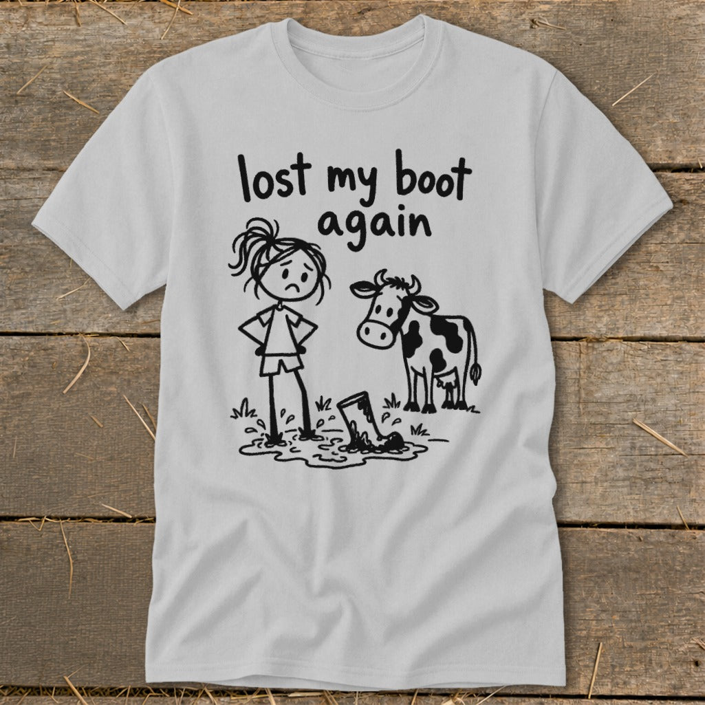 Light gray short-sleeve t-shirt with a humorous cartoon graphic and the text lost my boot again.