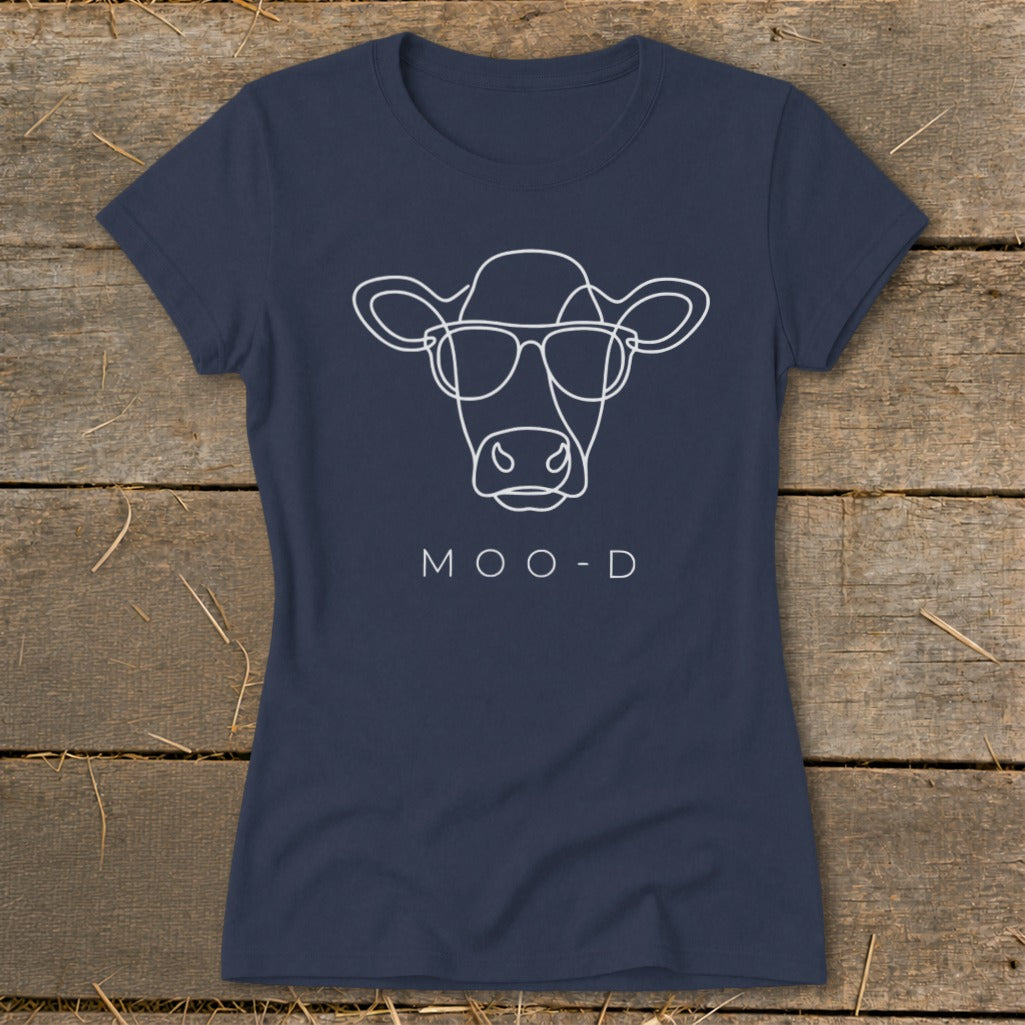 Navy t-shirt with white line drawing of a cow wearing sunglasses and the text "MOO-D".