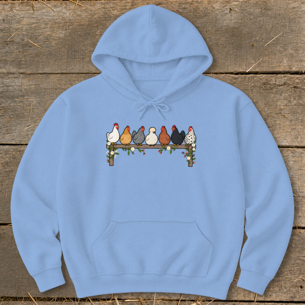 Light blue hooded sweatshirt featuring a front chest graphic of seven diverse chickens perched on a flower-covered wooden fence.