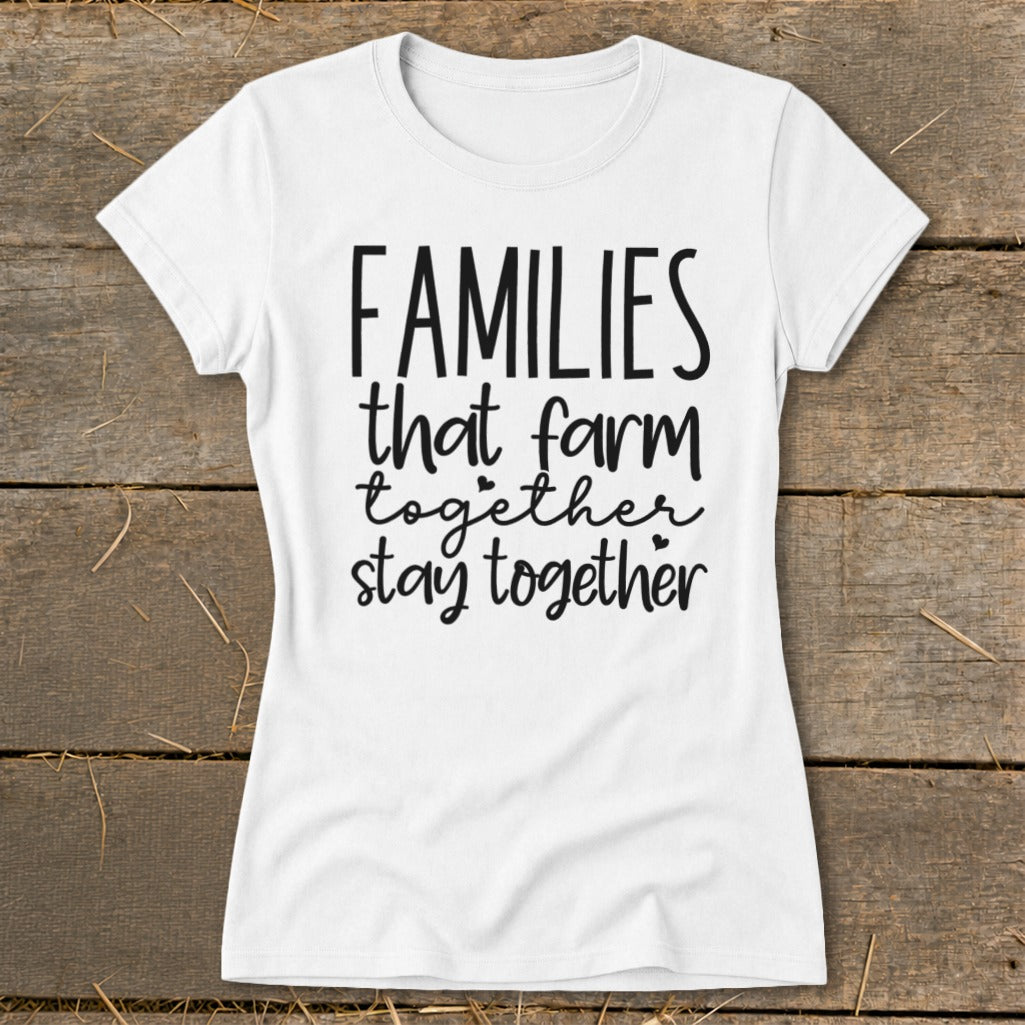 White t-shirt with black text: "FAMILIES that farm together stay together."