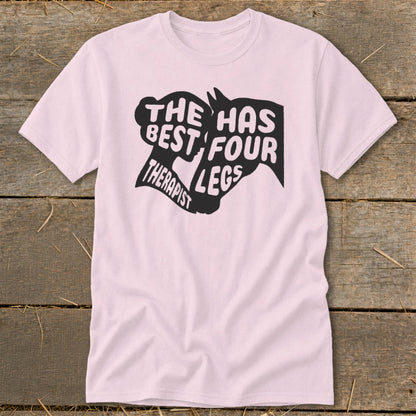 Pink t-shirt with black text and horse head graphic: "The best therapist has four legs."