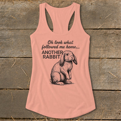 Peach tank top with text "Oh look what followed me home... ANOTHER RABBIT" and a rabbit illustration.