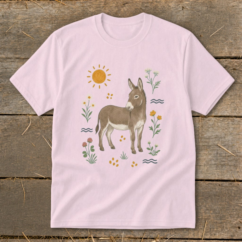 Light pink t-shirt with a watercolor donkey, sun, and wildflowers design.