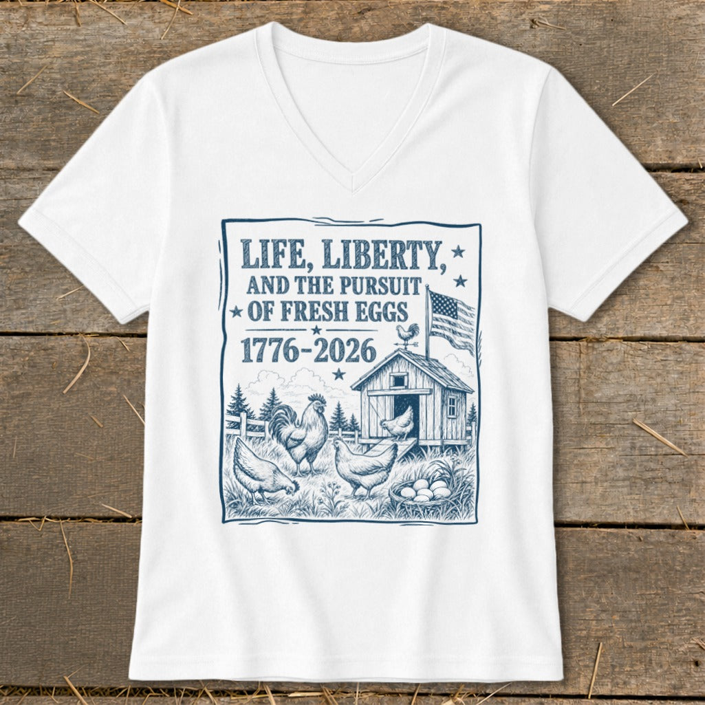 White t-shirt with graphic "Life, Liberty, and the Pursuit of Fresh Eggs" and farm scene.