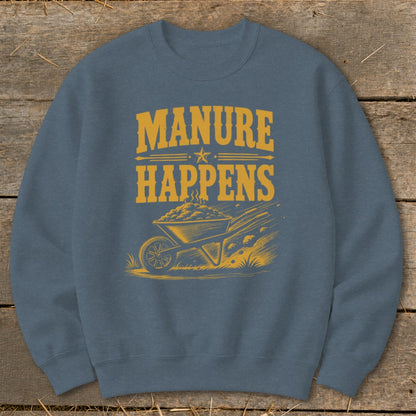 Blue sweatshirt with yellow text "Manure Happens" and a wheelbarrow graphic.