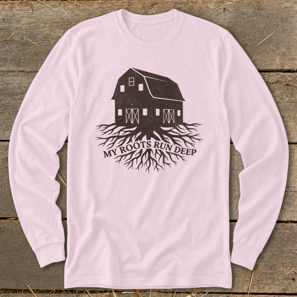Barn with roots and text "MY ROOTS RUN DEEP" on a pink shirt.