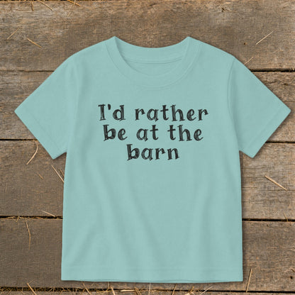 Teal t-shirt with "I'd rather be at the barn" printed in black.