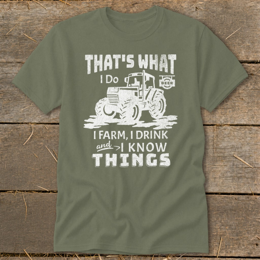 Olive green t-shirt with a white graphic of a tractor and the text "That's what I do. I farm, I drink and I know things."