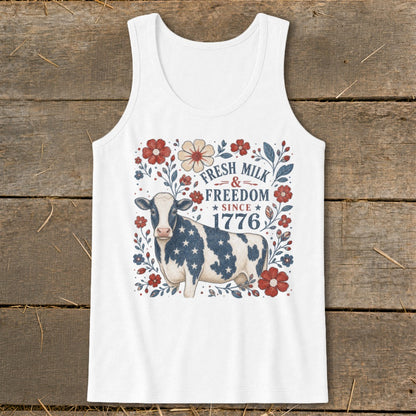 White tank top with a cow design reading "Fresh Milk & Freedom Since 1776".