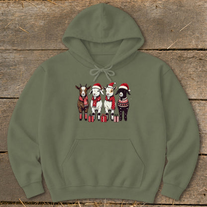 Four goats in Santa hats and scarves stand with presents.