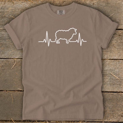 Brown crewneck t-shirt with a white graphic of a sheep integrated into a heartbeat line.
