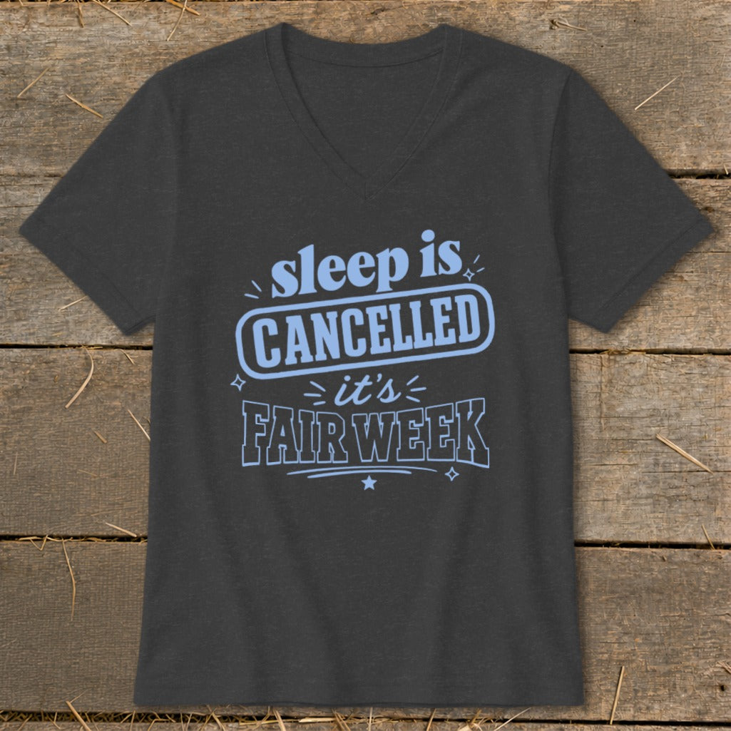 Dark grey v-neck t-shirt with blue text: "sleep is CANCELLED it's FAIR WEEK".