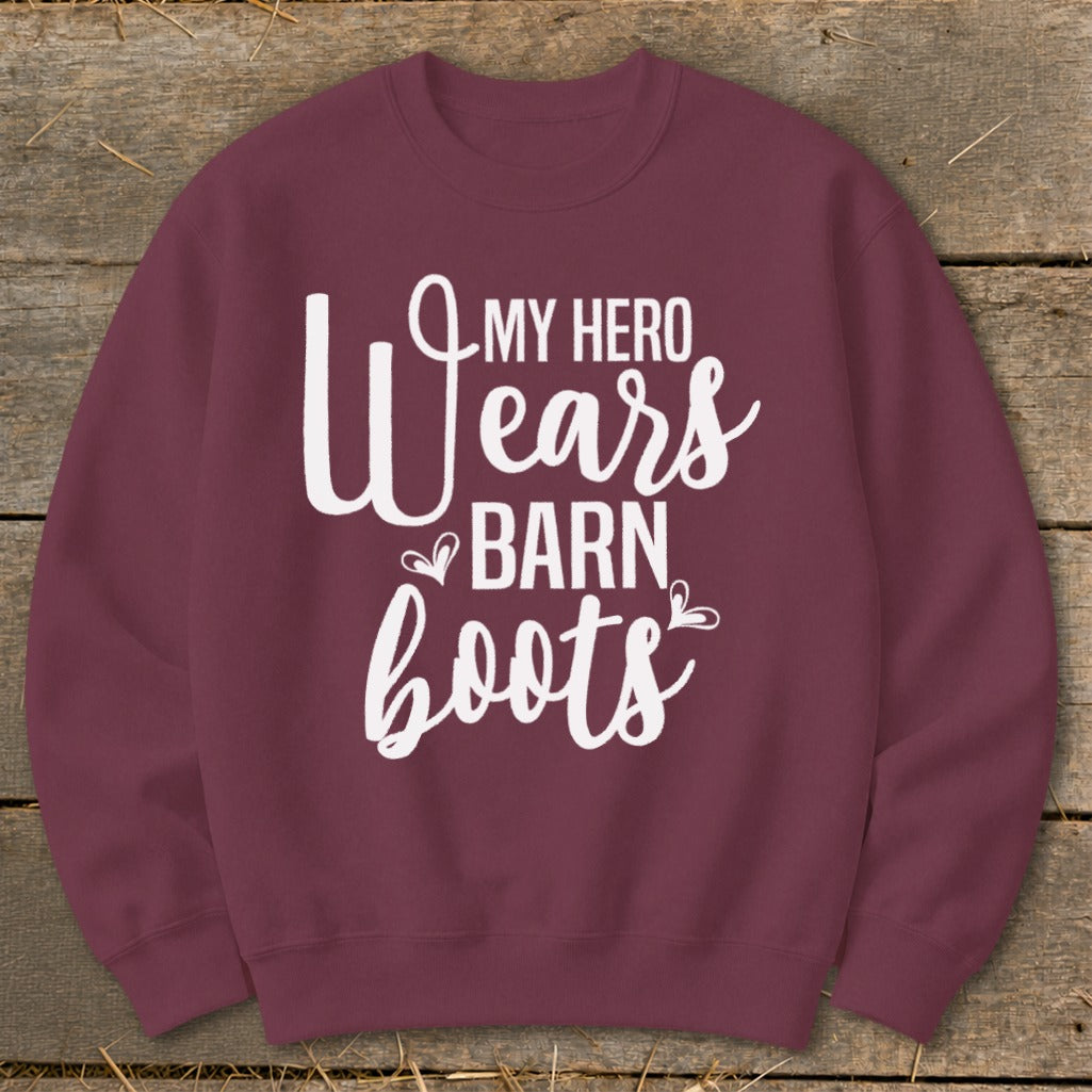 Maroon sweatshirt with white text that reads "My Hero Wears Barn Boots".
