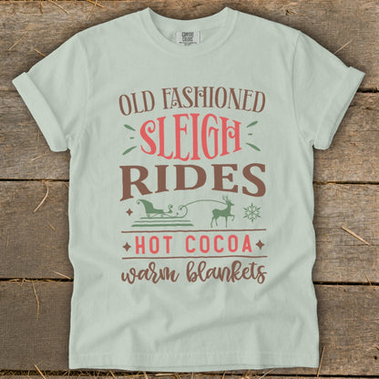 Light green t-shirt with "Old Fashioned Sleigh Rides Hot Cocoa Warm Blankets" text.