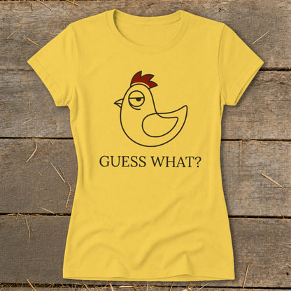 Yellow t-shirt with a cartoon chicken and the text "GUESS WHAT?".