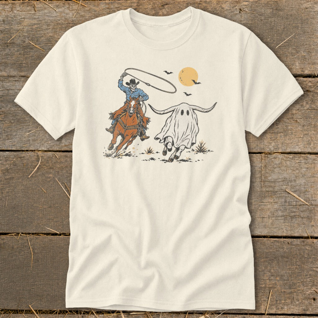 Skeleton cowboy on horseback chasing a ghost steer under a pale sun.