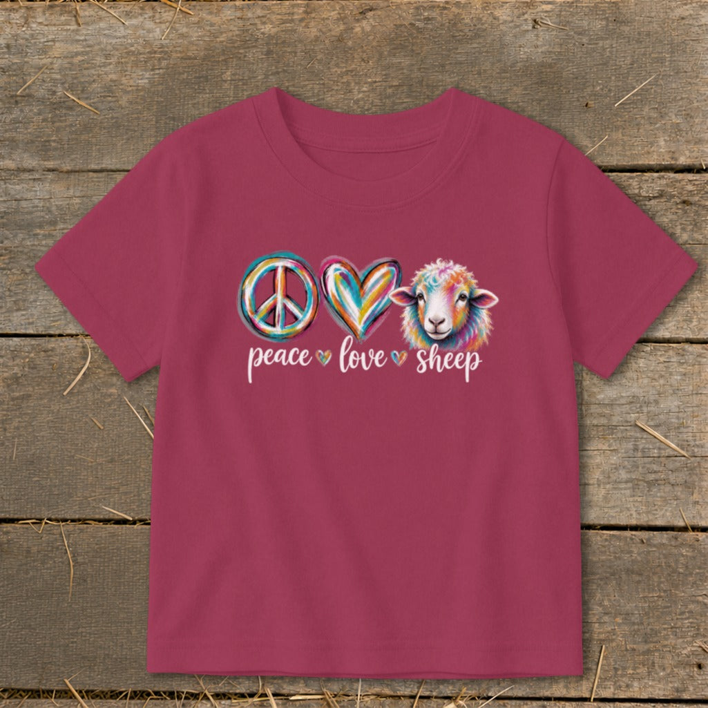 Children's t-shirt with peace, heart, and sheep graphic reading "peace love sheep".
