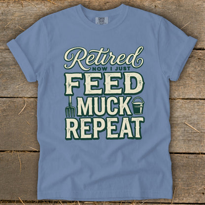 Blue t-shirt with "Retired Now I Just Feed Muck Repeat" graphic.
