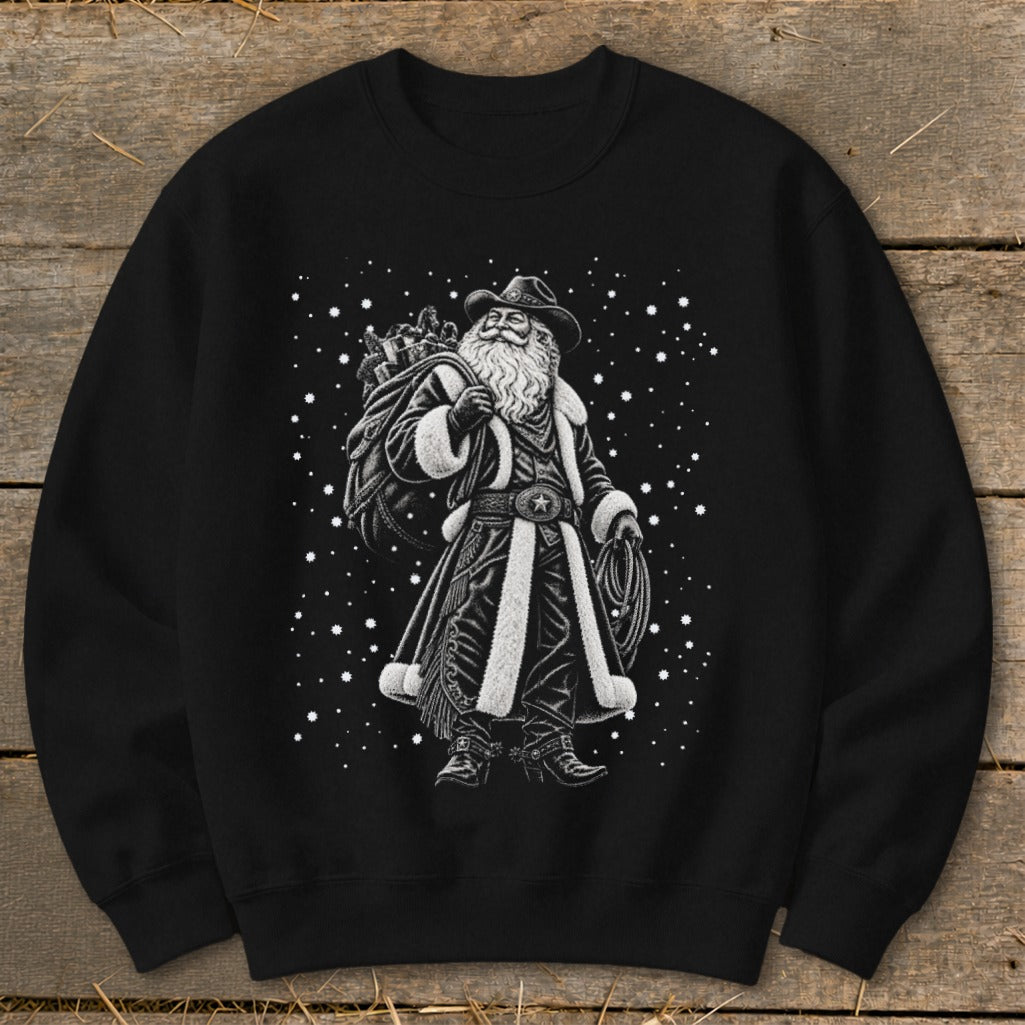 Black sweatshirt with black and white illustration of a cowboy Santa Claus and falling snow.