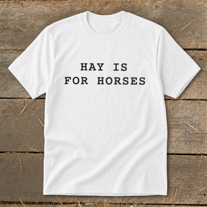 White t-shirt with black text that reads "HAY IS FOR HORSES."
