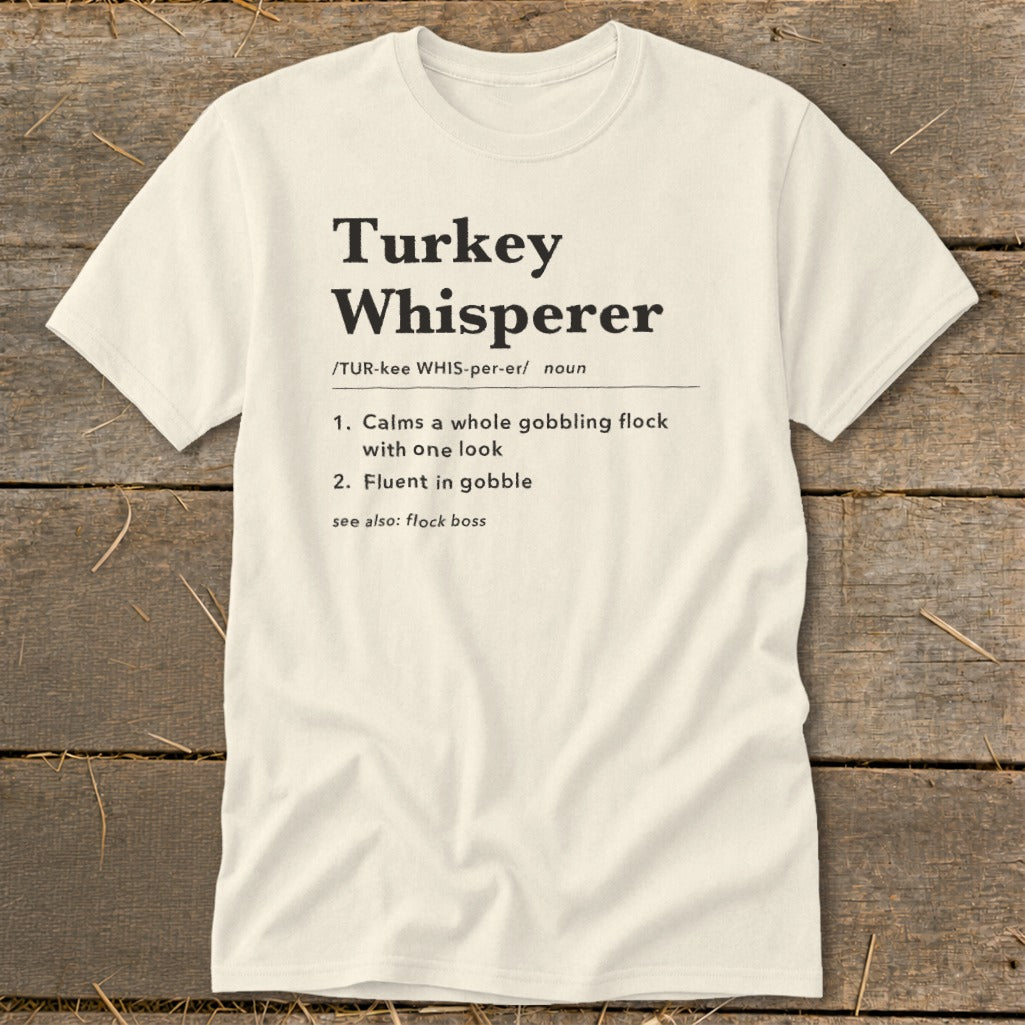 Cream t-shirt with "Turkey Whisperer" dictionary definition text.