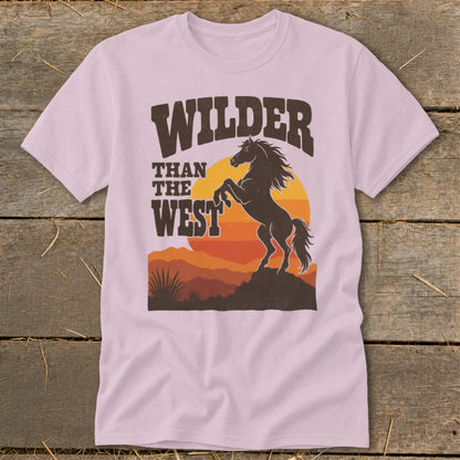 Pink t-shirt with "WILDER THAN THE WEST" text and rearing horse graphic.