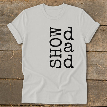 White t-shirt with black text "Dad Show" vertically printed.