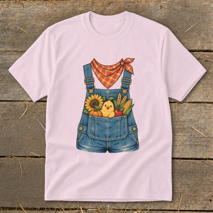 Pink t-shirt with cartoon overalls, chick, sunflower, pumpkin, corn, and apple graphic.